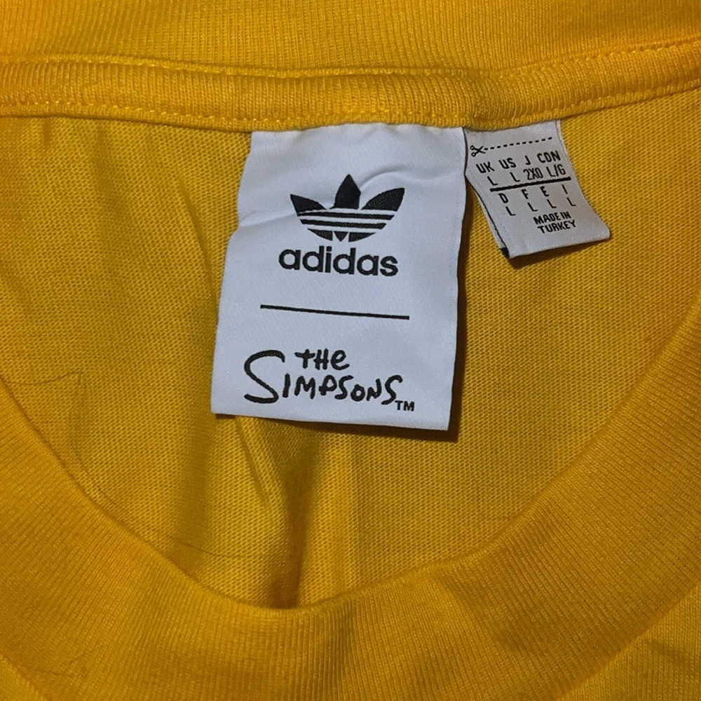 Adidas The Simpsons shirt.
